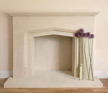 Shown here in Bath stone with arched, chamfered slips and a two-piece hearth.