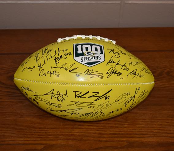 onto the football. Features the 100 seasons logo.