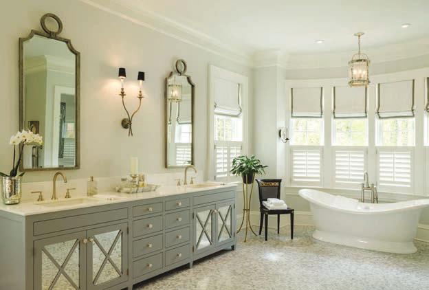 The large bathroom provided Shaw with expansive walls one of which now accommodates a double vanity with two sinks while another anchors a makeup table.