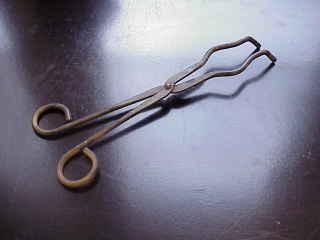 For handling hot crucibles; also used to pick up other hot