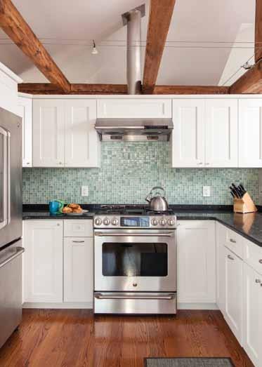 Left; top: White cabinetry and honed black granite countertops pop against the warm wood flooring and stainless appliances.