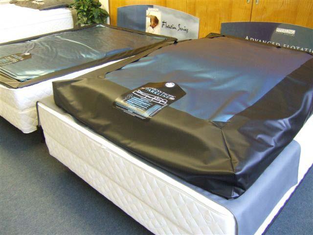 The bed in the forground shows an air inflated watermattress with