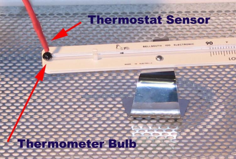 e. Place the thermometer where it can be seen through the view port (window).