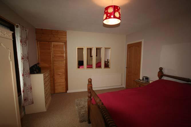 Bedroom 1 4.57 x 3.62 (15 0 x 11 10 or thereby). Double glazed window to front with vertical blinds, curtains and curtain pole. Fitted carpet. Central heating radiator.