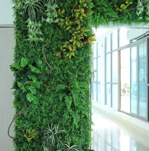 Life-like plants offer an alternative to a live planting system Artificial Walls Ambius Artificial