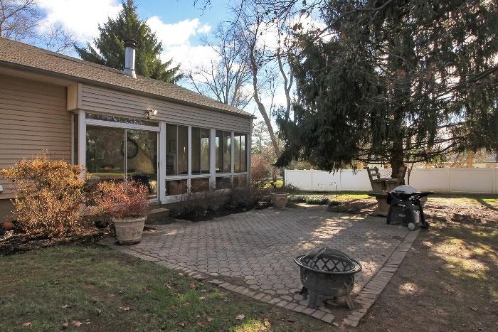 A spacious paver patio is accessed from the beautiful Sun Room.