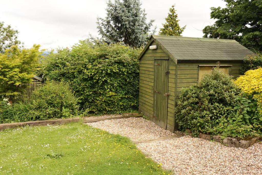 Continuing around the property to the east side of the house there is a water butt and log store and a further good sized garden shed measuring 8 x 12 (2.43 x 3.65m) connected to power.