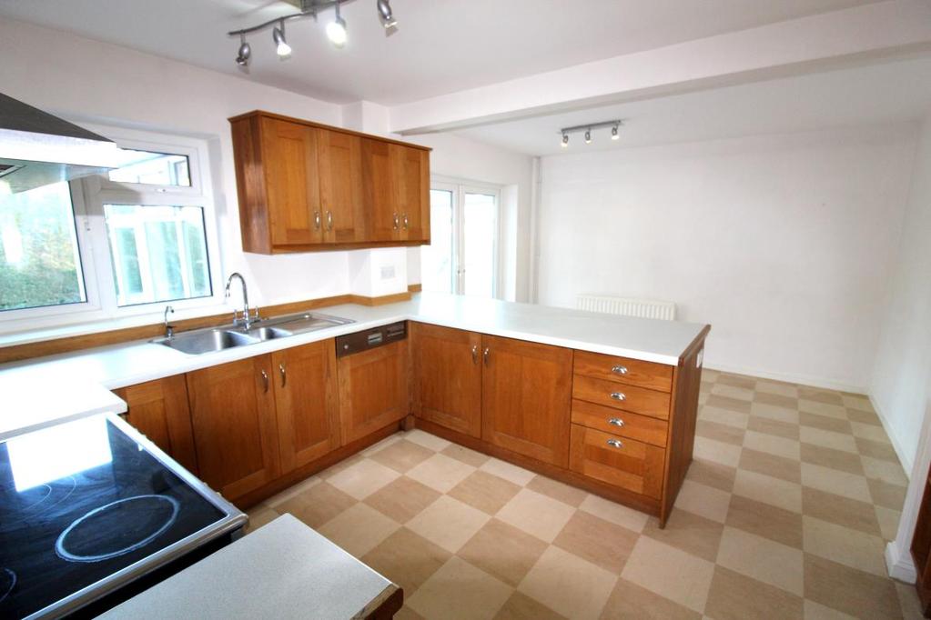 Kitchen/Breakfast Room measuring approximately 17 11 x 11 9 (5.46 x 3.58m) with range of fitted kitchen units comprising work top surfaces, draws and cupboard storage under. Fitted fridge and freezer.