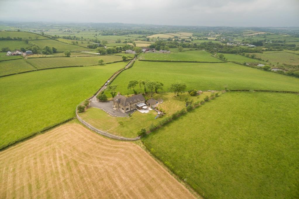 Set in an elevated position overlooking Aughnadarragh Lough, an area of special conservation, with exceptional views from the Cave Hills to the Mourne Mountains and a large slice of Co Down, this