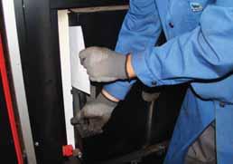 open: push the locking plate toward the front See "Adjusting the combustion chamber doors" [page 53] Checking the door stop seal Open the door Insert a sheet of paper at both the top and the bottom