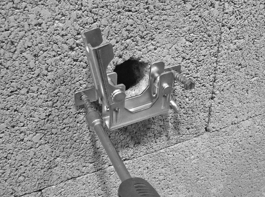 TO THE BRANCH LINE WARNING The following photos show the Style Surface Mount Bracket being installed in a sidewall application on a concrete block wall.