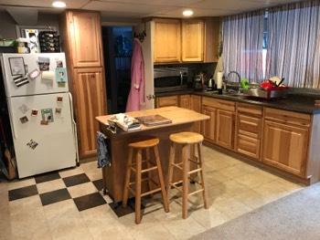 1. Kitchen Room Basement Kitchen Walls and ceilings appear in good condition overall. Flooring is Tile. Heat register present.