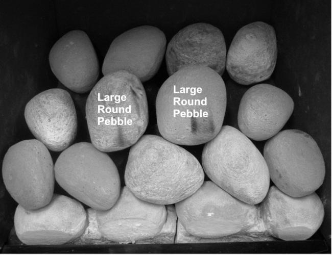 Lay a further two large round pebbles.