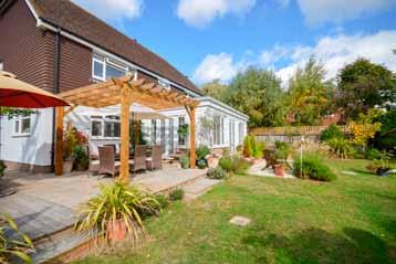 A terrace with pergola to the rear of the property is the perfect spot for outdoor entertaining and to the side of the house is a small kitchen garden with a greenhouse, wooden garden store and log