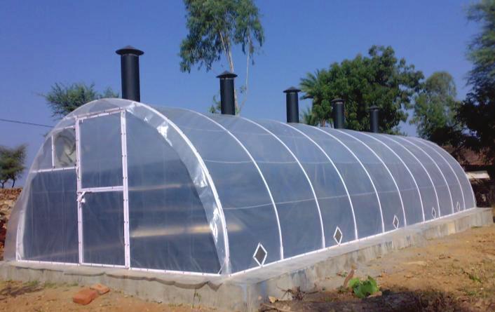 Figure 2: Closed view of solar tunnel dryer installed at factory premises. was used to record temperature at different locations inside solar tunnel dryer and ambient temperature.