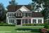 Shown with optional metal roofs, front door with transom, upgraded porch columns, and landscape package. Yardley Model