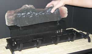 4) Insert the back brick panel first by carefully slipping it between the back wall of the firebox and the rear log bracket.