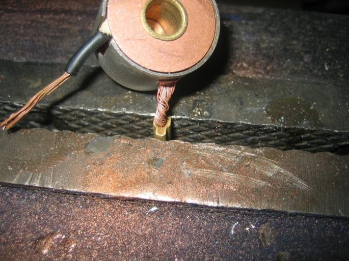 Crush the brass wire crimp in a vise the