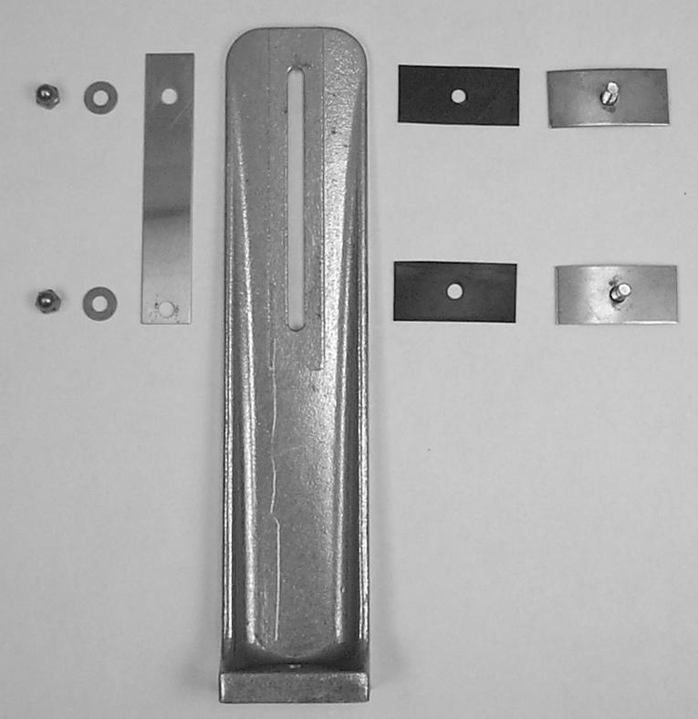 Assemble the legs as follows (Fig. 4): 1. Lay the peel trap on its side. 2. Assemble one of the rubber gaskets to one of the curved leg clamp bolts. 3.
