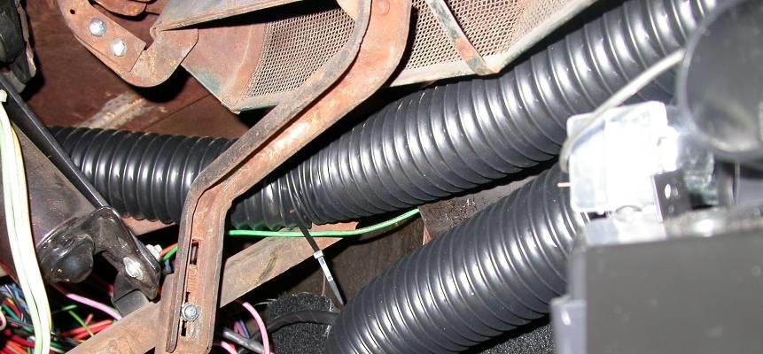 The next hose from the left of the passenger defrost hose, routes across the