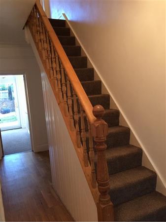 mottled effect fitted carpet on stairs.