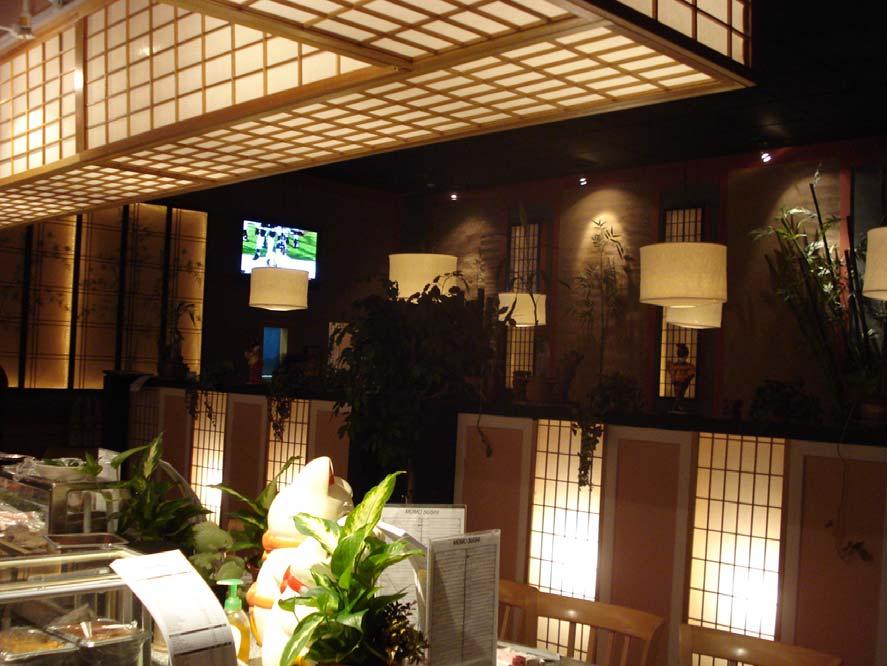 The lighting design within Momo Sushi is very successful in setting a relaxing and intimate mood. It also succeeds in the way that it divides the space into two sections: the bar and the dining room.