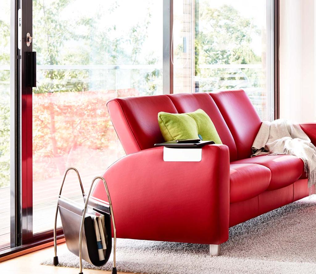 Stressless Arion sofa shown in Paloma Tomato/Steel legs. Stressless Duo table. Stressless Ellipse table. Stressless Easy armrest table. Our complete range of models is shown on pages 68-75.