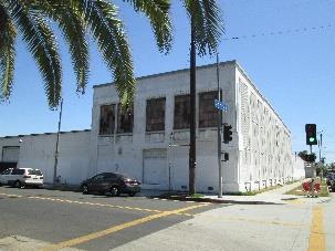 One of the few intact automobile-related commercial buildings observed in the area. Demonstrates the proliferation of the automobile in Los Angeles.