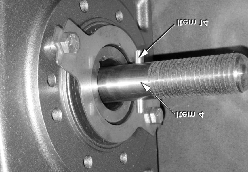 Slide the nylon spacer (item 13) over the shaft and pin to hold the pin in this position. See Figures 12 and 13.