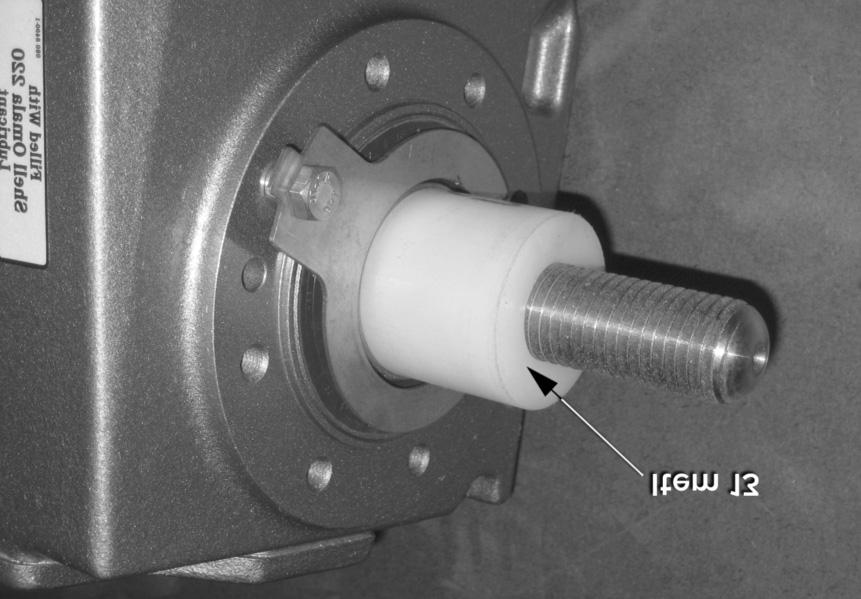 Slide the nylon locking knob (item 12), unthreaded end first, onto the threaded end of the shaft until the shaft comes into