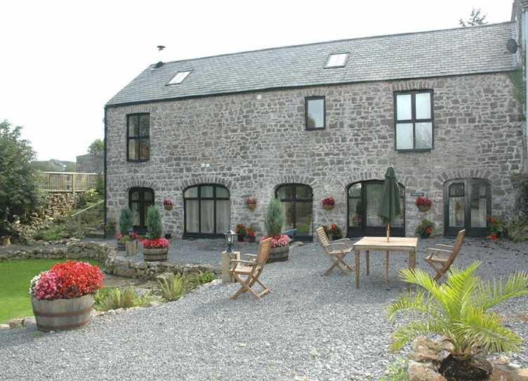 A Beautifully Restored Old Stone Barn which has been converted into a 4/5 bedroom family home retaining a wealth of character and charm including lounge area open to the eaves with exposed beams,