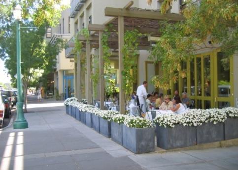 the commercial centers. Shade may be provided through awnings at least eight feet in height projecting from buildings, umbrellas, street trees, or other shade structures.
