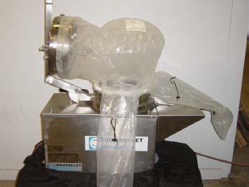 residual material from the inside of the containment envelope. The cover is closed, and the centrifuge is cleaned in place a second time to remove residual material from the centrifuge surfaces.
