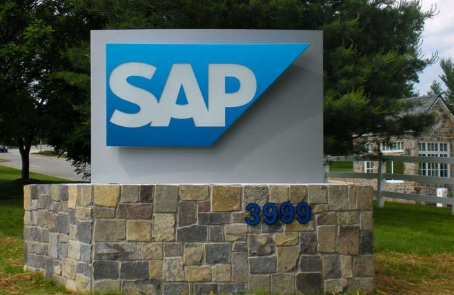 This sign consists of a curved stainless steel base and the standard SAP logo (gradient blue anvil shape and white SAP letters), along with the city name and/or the room location.