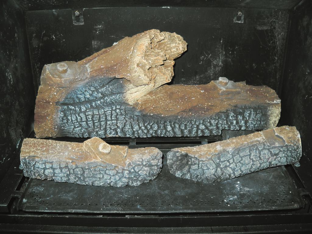 A quantity of ember stones is with the log set. Place the parts inside the firebox as illustrated in figs. 35-39. 1 WEAR GLOVES AND HANDLE THE LOG PARTS CAREFULLY.