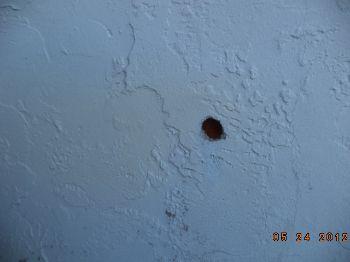 There is a small hole in the stucco at the rear elevation under the double master bedroom