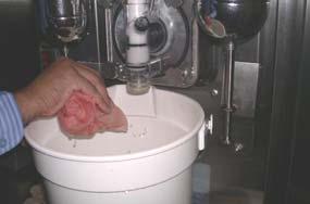 16. Using the dispensed Sanitizing solution and a clean Salmon cloth, sanitize all exterior