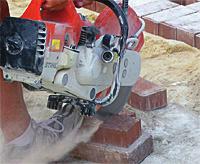 have already laid. "Click." Then you slide the paver along until a second side makes contact with another paver adjacent to the first. "Click." With these two pavers now serving as a guide, you lower the paver onto the base.