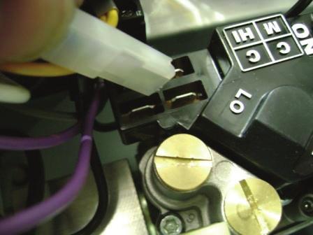 Step 4: Turn chassis over and remove the two pressure switch retaining screws.