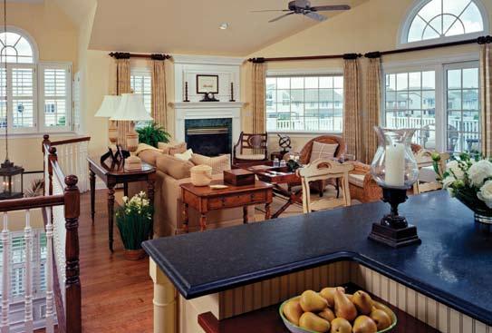 Paneled windows allow ample sunlight, and French doors lead to the deck overlooking the harbor.