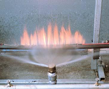 during a fire. A sample of cable is held horizontally over a ribbon flame at about 750 C.