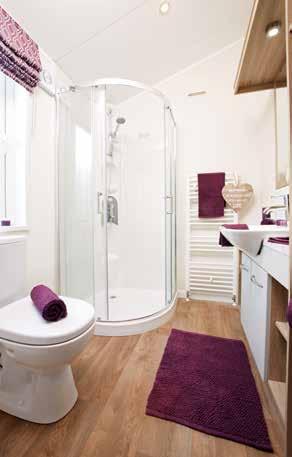 Integrated dishwasher Shower over bath with feature tile effect wet wall and concertina bath screen 2 en-suites, one with bath Utility room complete with sink, storage cupboard and plumbing with