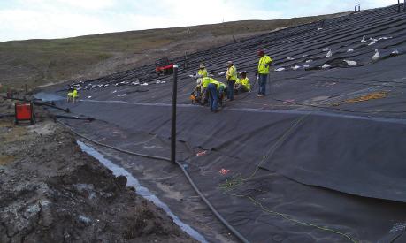 The best management practice for managing water in the geonet would be to provide a collection system at the lowest point of the slope to efficiently remove water from the geocomposite and drain it
