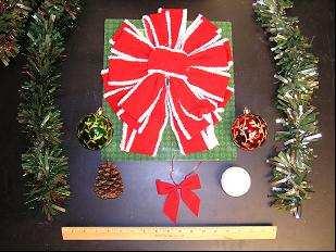 Tree skirt on carpeting Package with a 100 % polyester robe Plastic geometry in