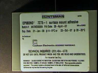 Photo 3 Adhesive label as supplied Testing Protocol: The two test samples were examined, as received, and primary areas of contamination were documented.