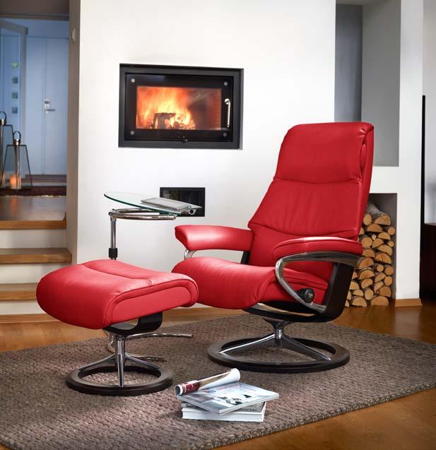 A Stressless ensures that everyone has the perfect start to the day. Stressless Flexi table. Stressless View (M) Signature recliner shown in Paloma Tomato / Wenge.