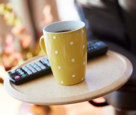 This small, versatile table provides a practical place to set your remote