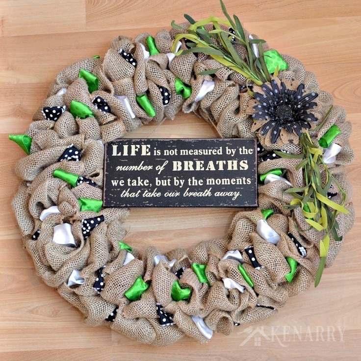 10. Breathtaking Inspirational Wreath This wreath uses three accent ribbons, artificial grasses, a