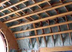This barrel ceiling (above) would be difficult to insulate and seal with traditional materials. It s an ideal candidate for spray foam, which conforms to its irregular surfaces (left).