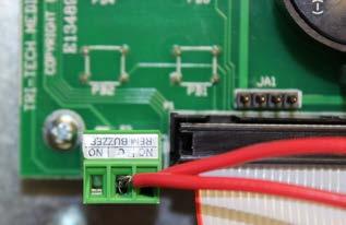 The dry contacts which provide the general fault alarm condition are located on the bottom edge of the board.